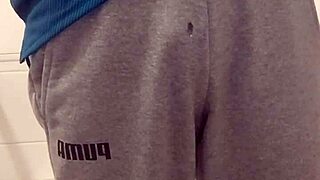 Man Pees in Bathroom Stall