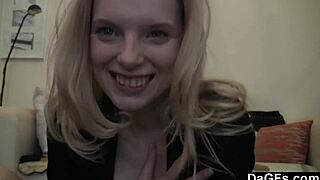 Young 18+ blonde undresses on webcam, rips clothes, and masturbates on sofa.