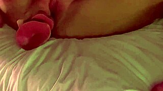 She indulges in self-pleasure, exploring her body with gentle touches and building excitement in a private moment.