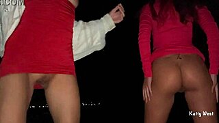 Two teenage girls take a leak on a public beach