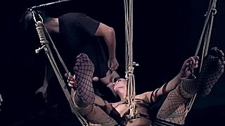 She's my pretty bitch, sucking and swallowing cock in full suspension bondage.