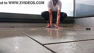 Ever seen masked girl masturbate in rain on balcony?