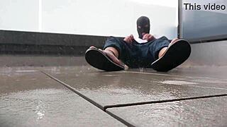 Ever seen masked girl masturbate in rain on balcony?