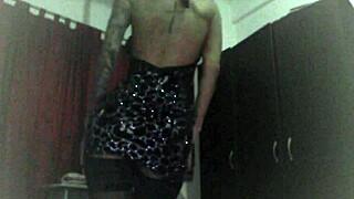 Amateur recording of a cam girl in black stockings doing a striptease