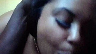 A massive black cock is being serviced by Sexy Miss Mazi