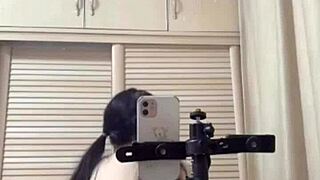 Young Asian girl gives a footjob before riding cowgirl