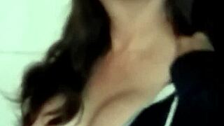 Is that sexy brunette milf smoking topless outdoors?