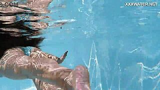 Hot Hungarian teen Lana swims nude in the pool, showing her juicy ass underwater.