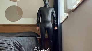 i'm wearing the latex collection catsuit, feeling the rubber tight on my skin.