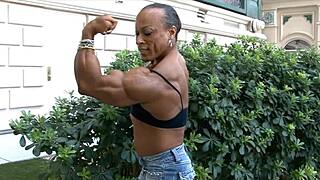 Muscular women with massive biceps dominate the scene, showcasing raw power and femdom control in every flex.