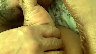 Wife sucks my cock while giving a handjob, focusing on feet and toes in fetish play.