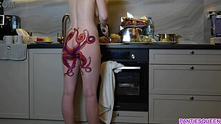 naked housewife with octopus tattoo cooks dinner in kitchen ignoring you