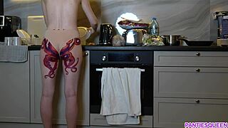 naked housewife with octopus tattoo cooks dinner in kitchen ignoring you