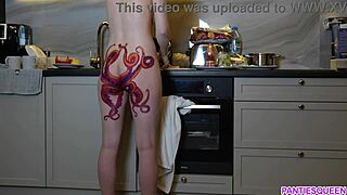 naked housewife with octopus tattoo cooks dinner in kitchen ignoring you