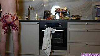 naked housewife with octopus tattoo cooks dinner in kitchen ignoring you