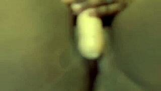 Black beauty gets self-pleasure with a big dick dildo.