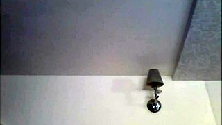 A sexy babe in a miniskirt smokes in a private setting.