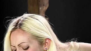 Punishing the blonde girl with a cane
