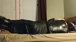 Crossdresser Binds Himself In Leather Boots And Chokes With Gagging Bondage