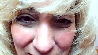 Mature woman shows saggy tits on webcam