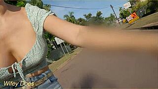 wife flashes big tits during public bike ride on streets.