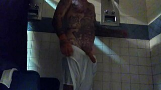Stroking big tattd up white dick in shower.