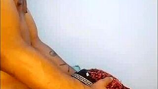 The streaming model performs a sloppy blowjob on webcam