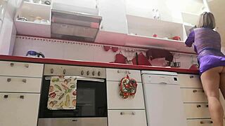 I spy on my stepmom in the kitchen, teasing with her skirt up.