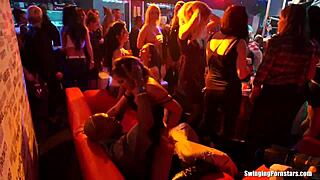 blonde party chick gets banged hard in wild club gangbang