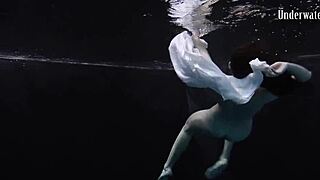 Andrejka performs astonishing underwater moves in bikini pool