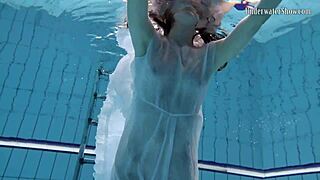 Andrejka performs astonishing underwater moves in bikini pool
