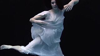 Andrejka performs astonishing underwater moves in bikini pool