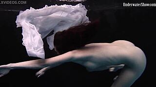 Andrejka performs astonishing underwater moves in bikini pool