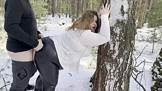 Chubby hottie in leather sucks cock and offers juicy ass in snowy woods