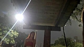 A daring street handjob for a hot redhead at the bus stop