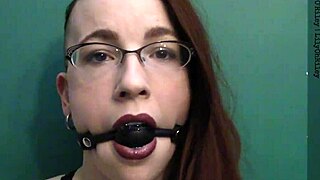 Dark lipstick and drooling with a ballgag, staring deep into your eyes