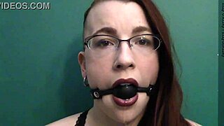 Dark lipstick and drooling with a ballgag, staring deep into your eyes