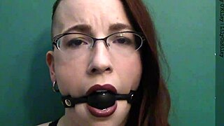 Dark lipstick and drooling with a ballgag, staring deep into your eyes