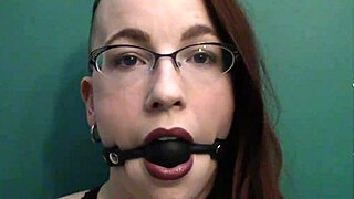 Dark lipstick and drooling with a ballgag, staring deep into your eyes