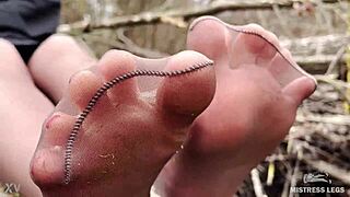 goddess teases with tan pantyhose feet in spring forest