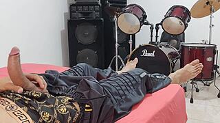 Man strokes his massive cock intensely