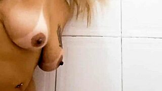 i am in the bathroom inserting a dildo into my pussy