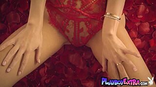 Petite blonde teen Elsa Jean strips naked among red petals for a stunning show