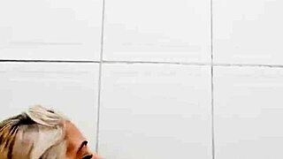 i am in the bathroom inserting a dildo into my pussy