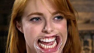 Busty redhead whipped hard in stocks, holy hell!