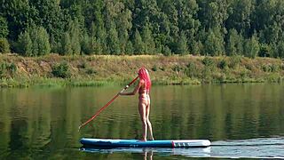 Skinny babe flashes pink micro bikini outdoors