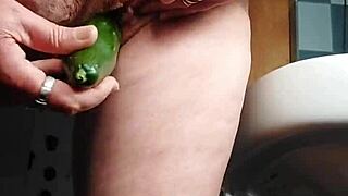 German Granny Slams Hairy Pussy with Cucumber in Kitchen