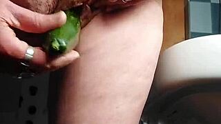 German Granny Slams Hairy Pussy with Cucumber in Kitchen