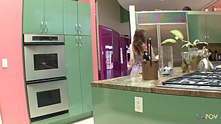 the brunette lesbian licks in the kitchen, then moves to couch for pussy eating and fingering