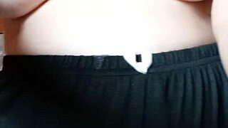 this pregnant milf spits on her big tits and nipples for fun